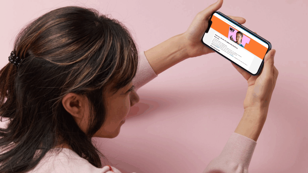 Student looking at VET course information on phone