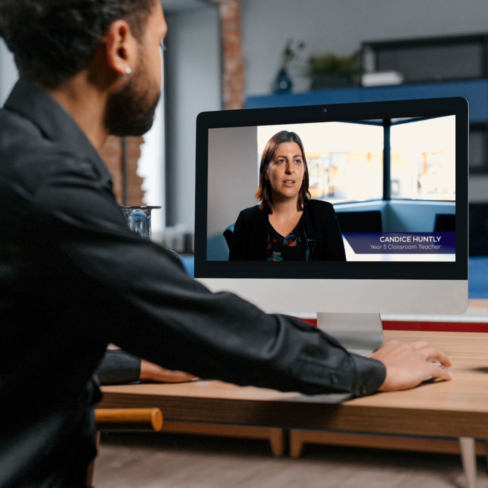 Male watching a video of testimonials